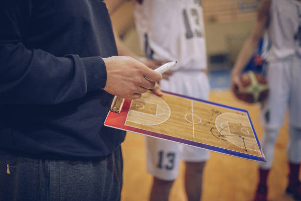 Coach talking to a basketball players