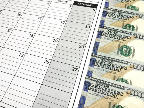 istock One Hundred Dollar bills in Calendar Agenda. Photo image 907408964