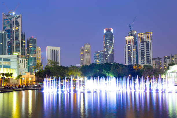 istock modern buildings in modern city at night 907430612