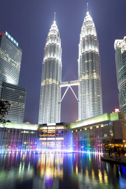 istock modern buildings in modern city at night 907432726