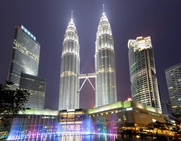 istock modern buildings in modern city at night 907432852
