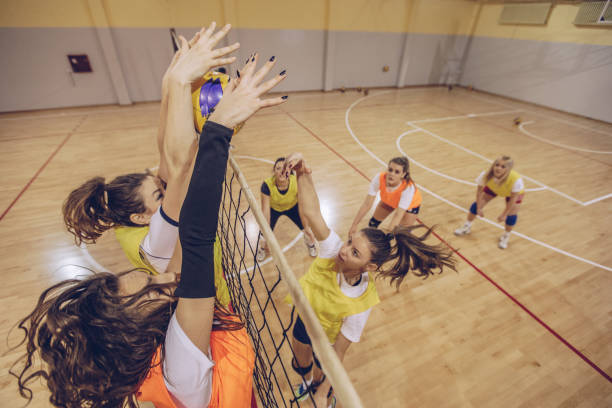istock Girls volleyball match 907444660