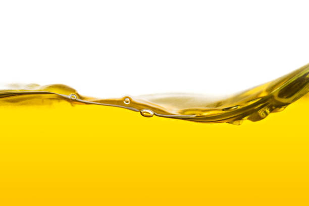 растительное масло фон - isolated on yellow фотографии стоковые фото и изображения