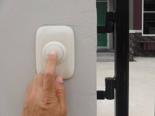 istock Men hand pushing Door Bell 907479882
