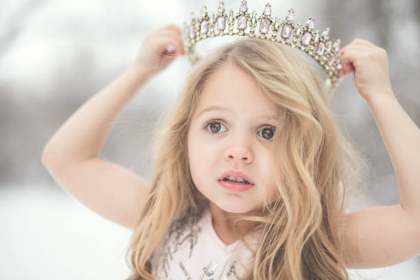 Portraits of a 4 year old little girl in the snow.