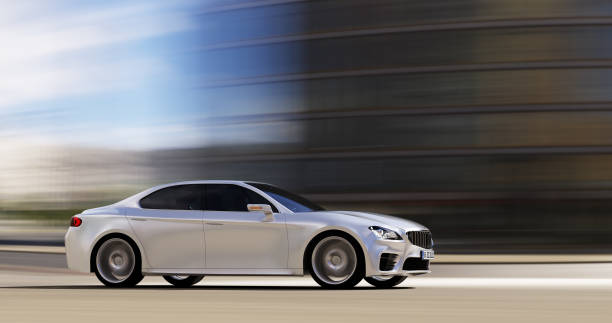 istock car driving on urban road 907503630