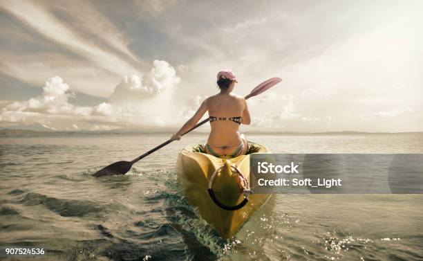 Woman Traveler Exploring Calm Tropical Bay By Kayak Stock Photo - Download Image Now
