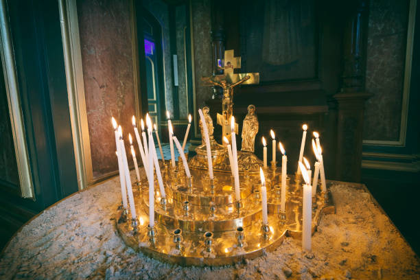istock Burning Candles Inside The Church 907527694