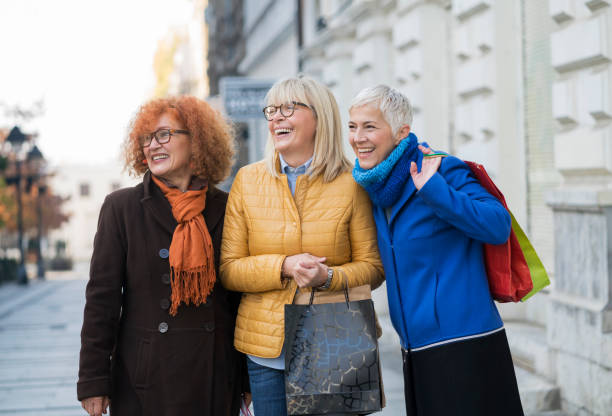 istock Three mature women out in shopping 907542968