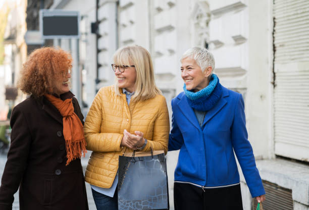 istock Three mature women out in shopping 907542986