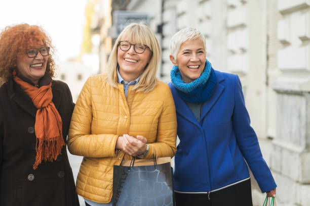 istock Three mature women out in shopping 907543044