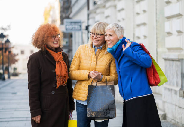 istock Three mature women out in shopping 907543156