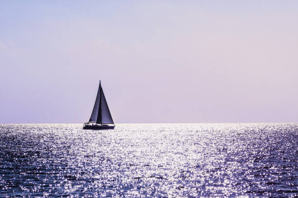 Beautiful bay with sailing boat at sunset, Croatia