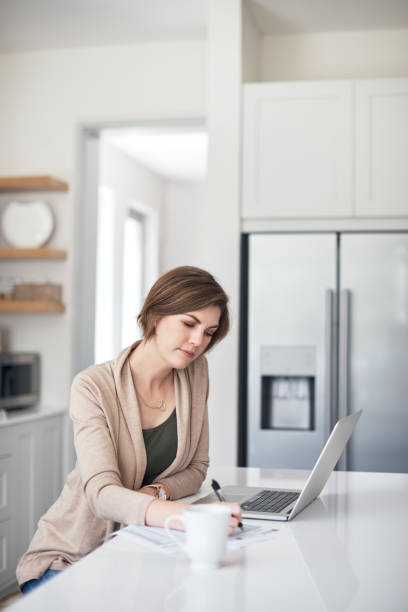 istock Taking the day to get her budget together 907548936