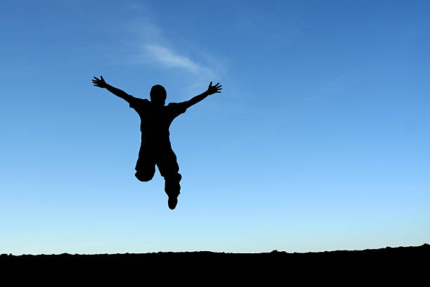 istock A silhouette of a happy man jumping 90754902
