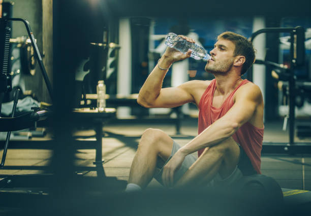 istock Refreshment on a sports training in a gym! 907552124