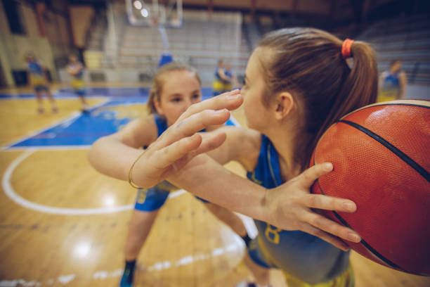 istock Women playing basketball 907556034
