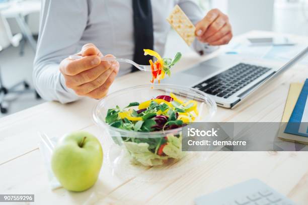 Businessman Having A Lunch Break Stock Photo - Download Image Now - Office, Lunch, Eating