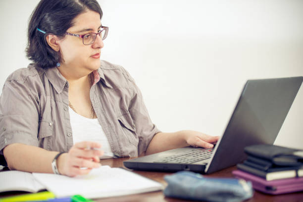 istock Adult Woman Working in Office 907563534