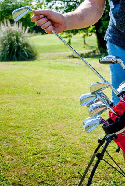 istock Golfer Choosing a Golf Club from the Golf Bag 907563710