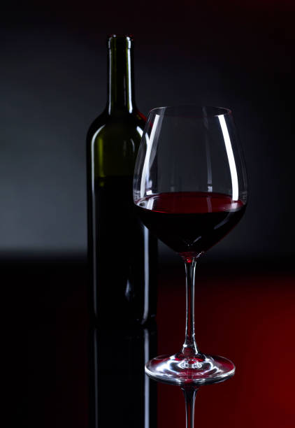 istock Glass and bottle of red wine. 907563902