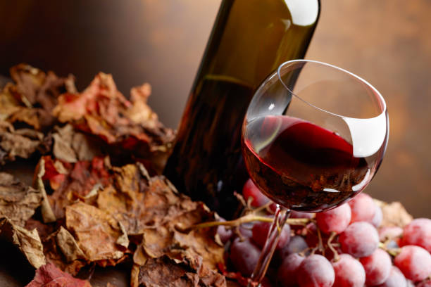 istock Glass and bottle of red wine . 907563948