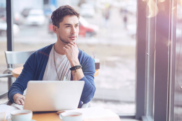 istock Attractive young freelancer touching his chin 907564988