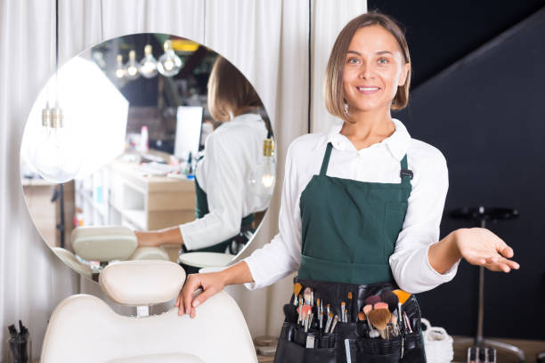 istock woman visagiste standing with brushes 907571814