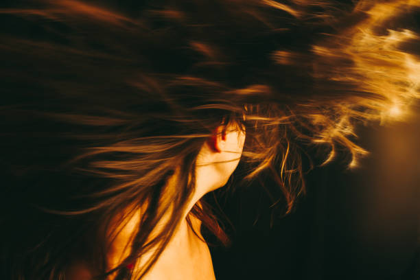 istock Woman with long hair turning 907577950