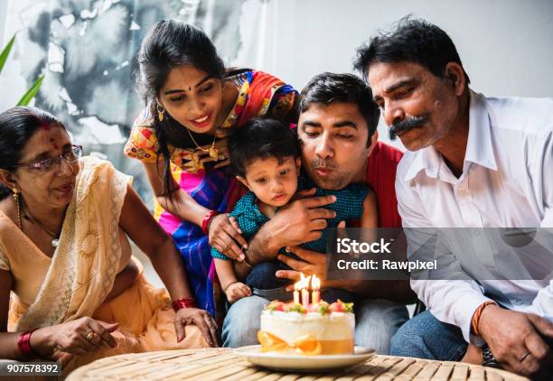 Indian Family Celebrating A Birthday Party Stock Photo - Download Image Now - Family, India, Culture of India