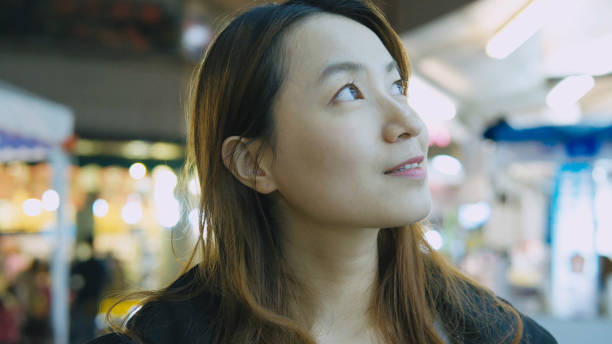 istock Young woman looking at camera 907593518
