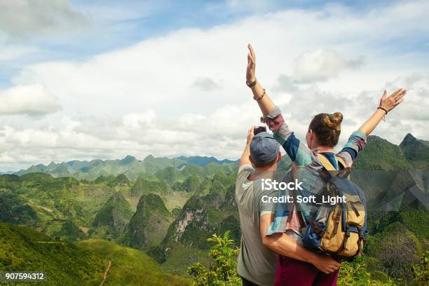 Couple Of Tourists Making Selfie On Background Of Karst Mountains Stock Photo - Download Image Now