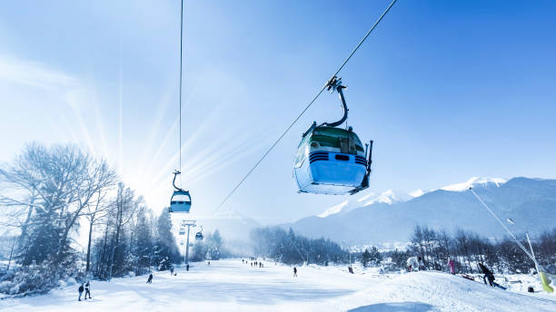 Gondola lift at ski resort in winter. Pirin Mountains. Ropeway station in Bansko stock photo