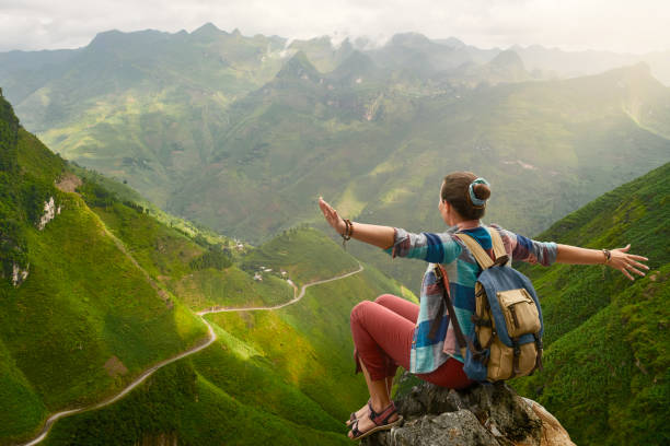 istock Hiker with backpack in mountains enjoying view at mountains. 907598564