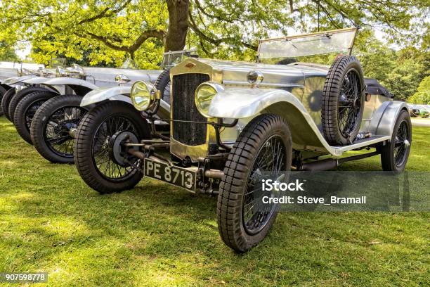 Line Of Silver Frazernash Cars Stock Photo - Download Image Now - Antique, Bumper, Car