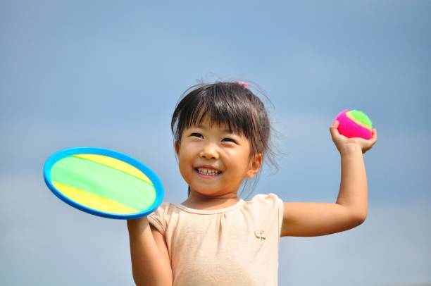 istock Girl's playing with ball 907598938