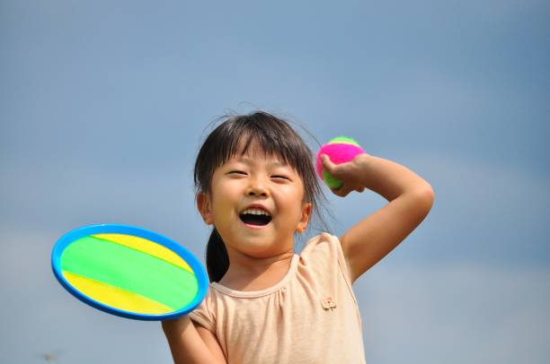 istock Girl's playing with ball 907598940