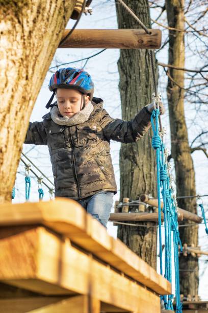 istock Child in Adventure Park 907605194