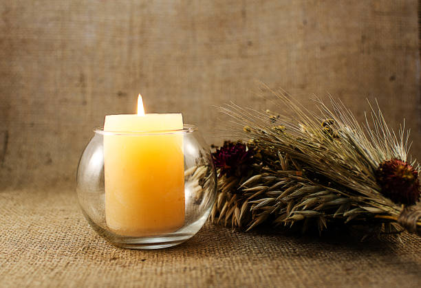 istock A scented candle on the background for a good mood 907605648