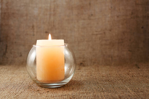 istock A scented candle on the background for a good mood 907605650