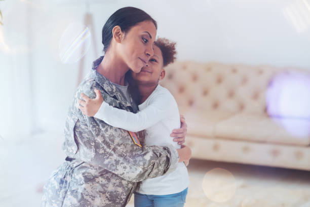istock Cute happy girl looking at her mother 907610054