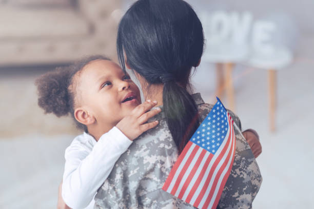 istock Joyful cute girl looking at her mother 907611310