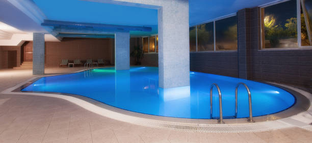 istock Luxury resort indoor swimming pool 907613810