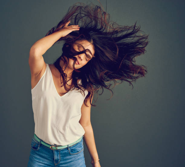istock Her hair has a mind of it's own 907613862