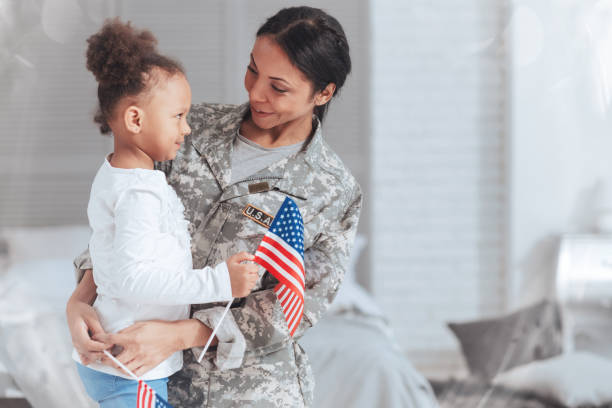 istock Cheerful nice woman wearing a military uniform 907613878