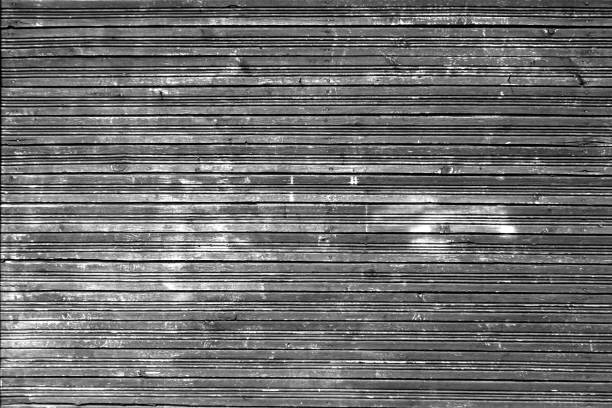 istock Wood fence texture in black and white. 907613938