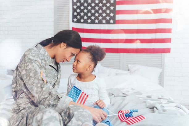 istock Joyful positive mother and daughter looking at each other 907614322