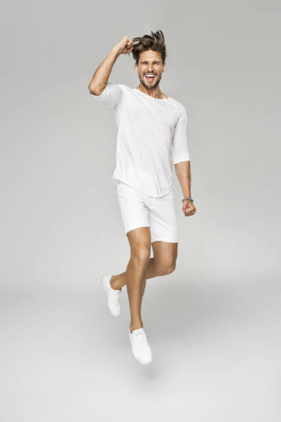 gut aussehender mann - white clothing stock-fotos und bilder