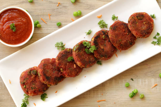 Vegetable cutlet or patties are a delicious snack made from boiled mixed vegetables. stock photo