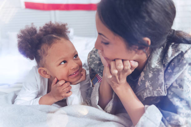 istock Delighted pretty girl looking at her mother 907614738